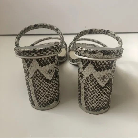 Dolce Vita Noles snakeskin heeled sandals.