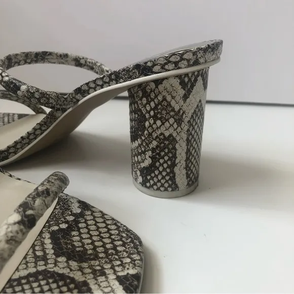 Dolce Vita Noles snakeskin heeled sandals.