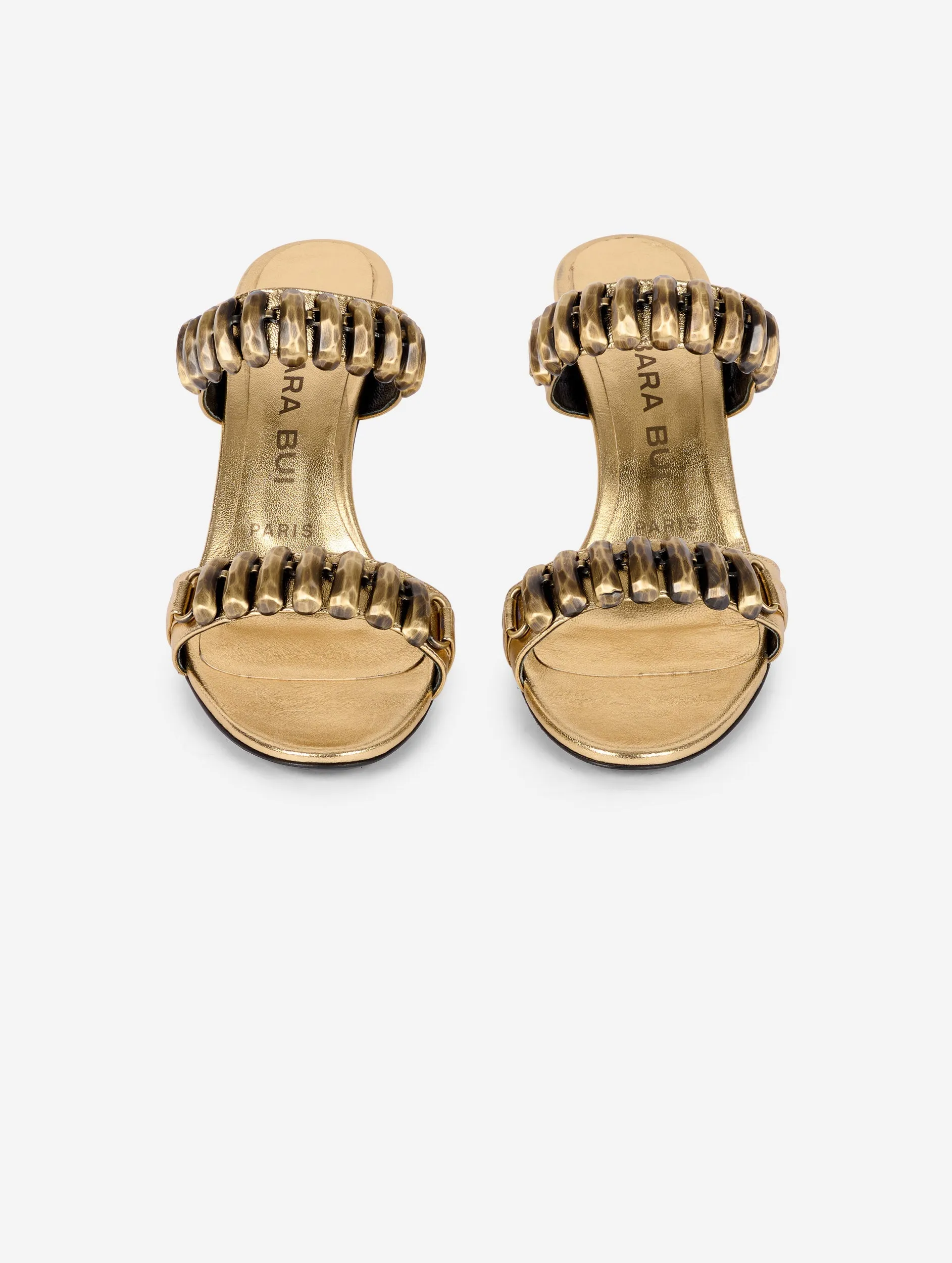 Mules in gold metallic leather