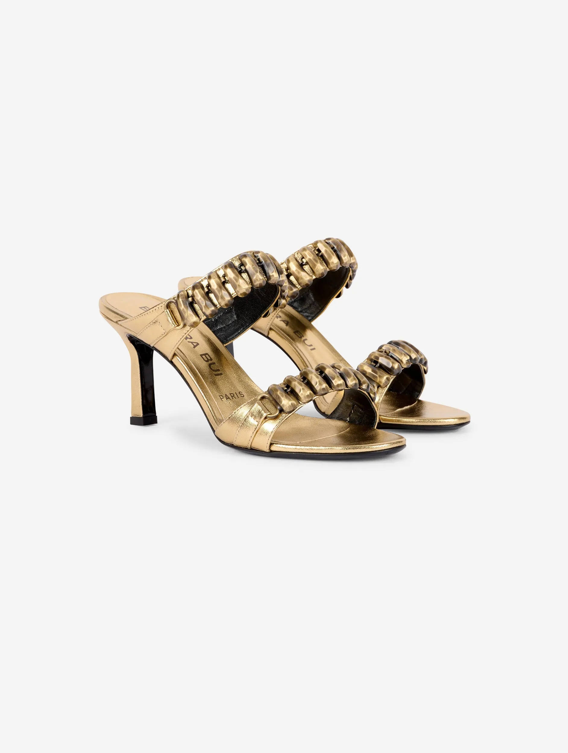 Mules in gold metallic leather