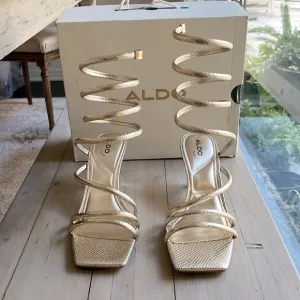 NIB. Aldo Twirly Snake Embossed Ankle Wrap Heeled Sandal in Metallic Gold  7.5